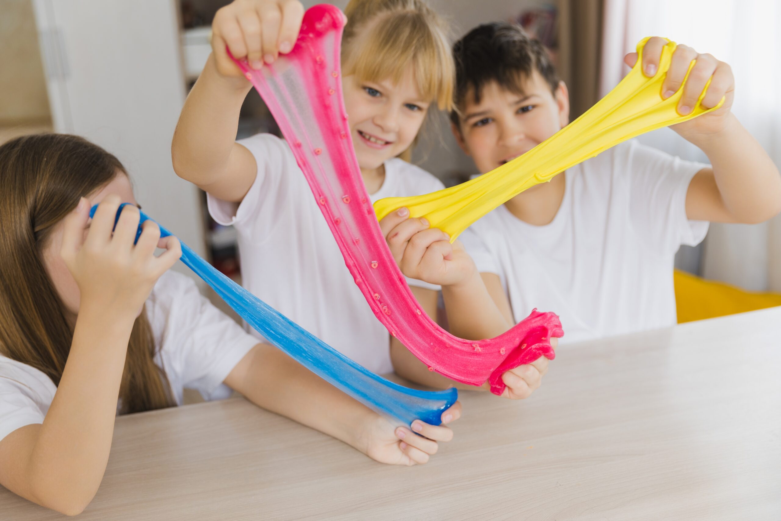 Group,Of,Kids,Making,A,Multicoloured,Slime,,Pink,,Blue,And